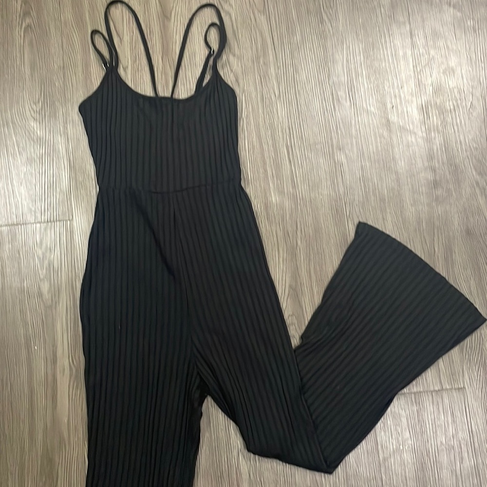 Black ribbed boot cut jumpsuit.